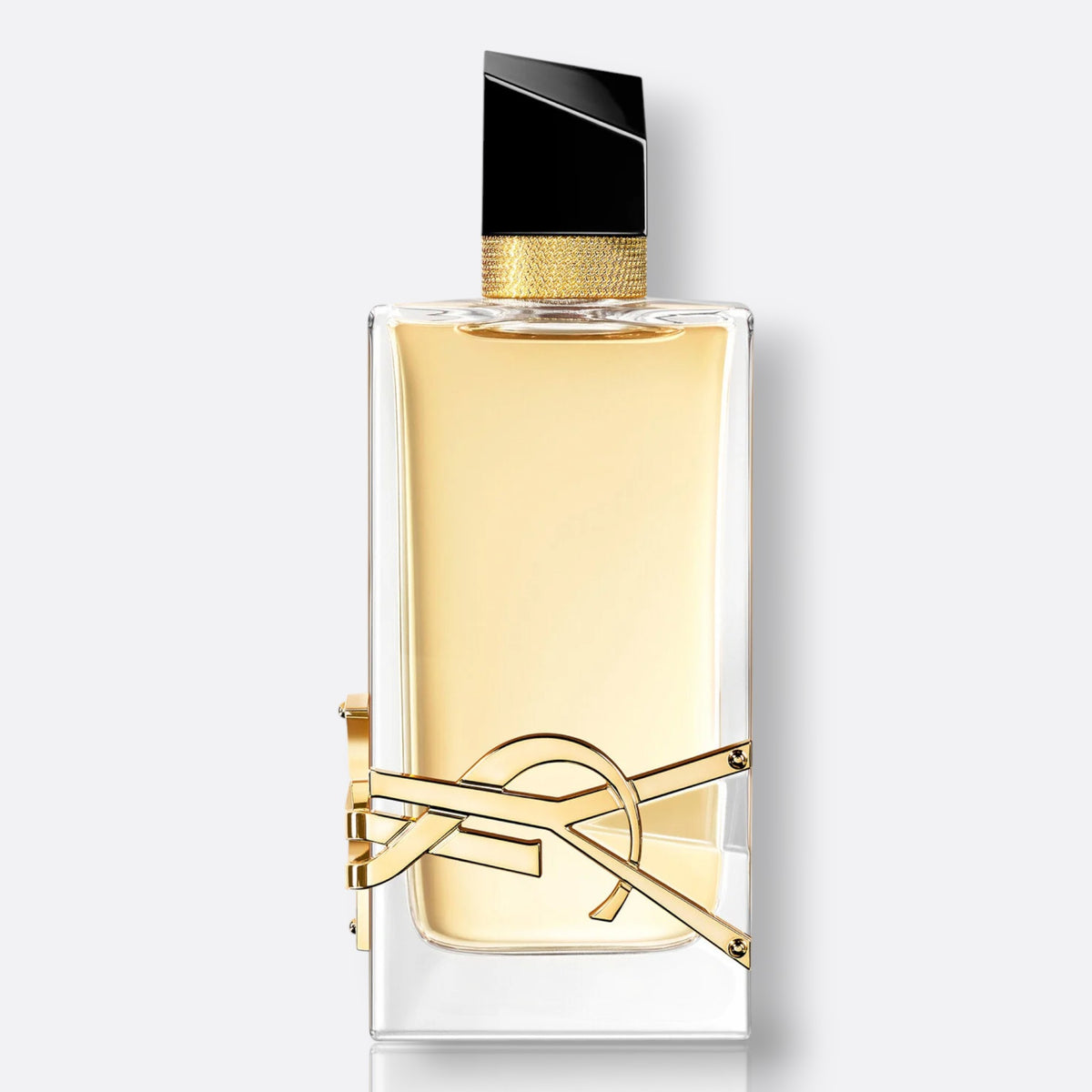 YSL Libre Eau de Parfum bottle — flat clear glass with a large gold YSL monogram and black cap
